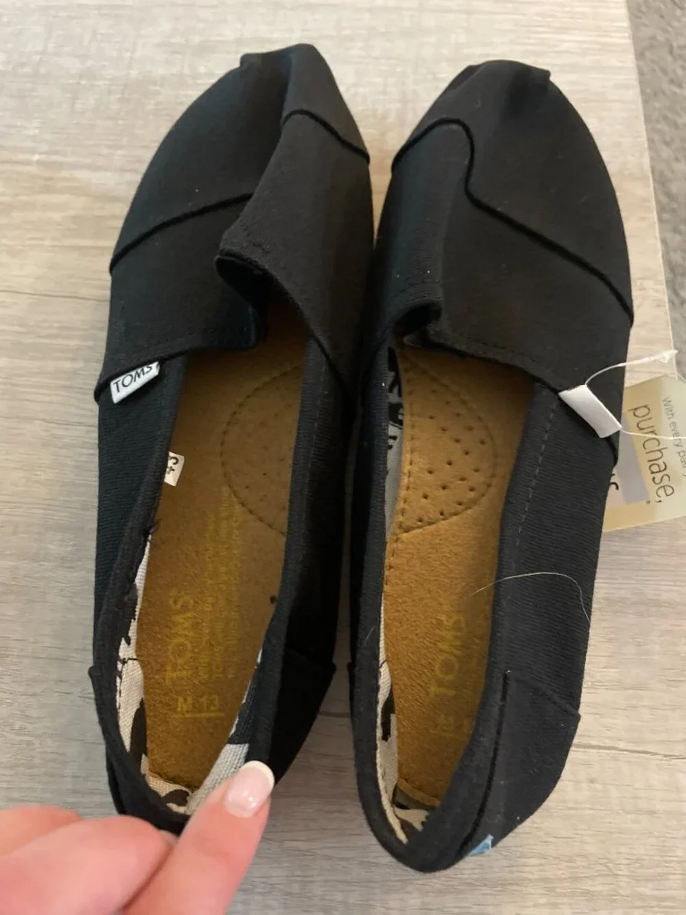 Toms Classic Slip-On Canvas Shoes in Black with Tan Sole
